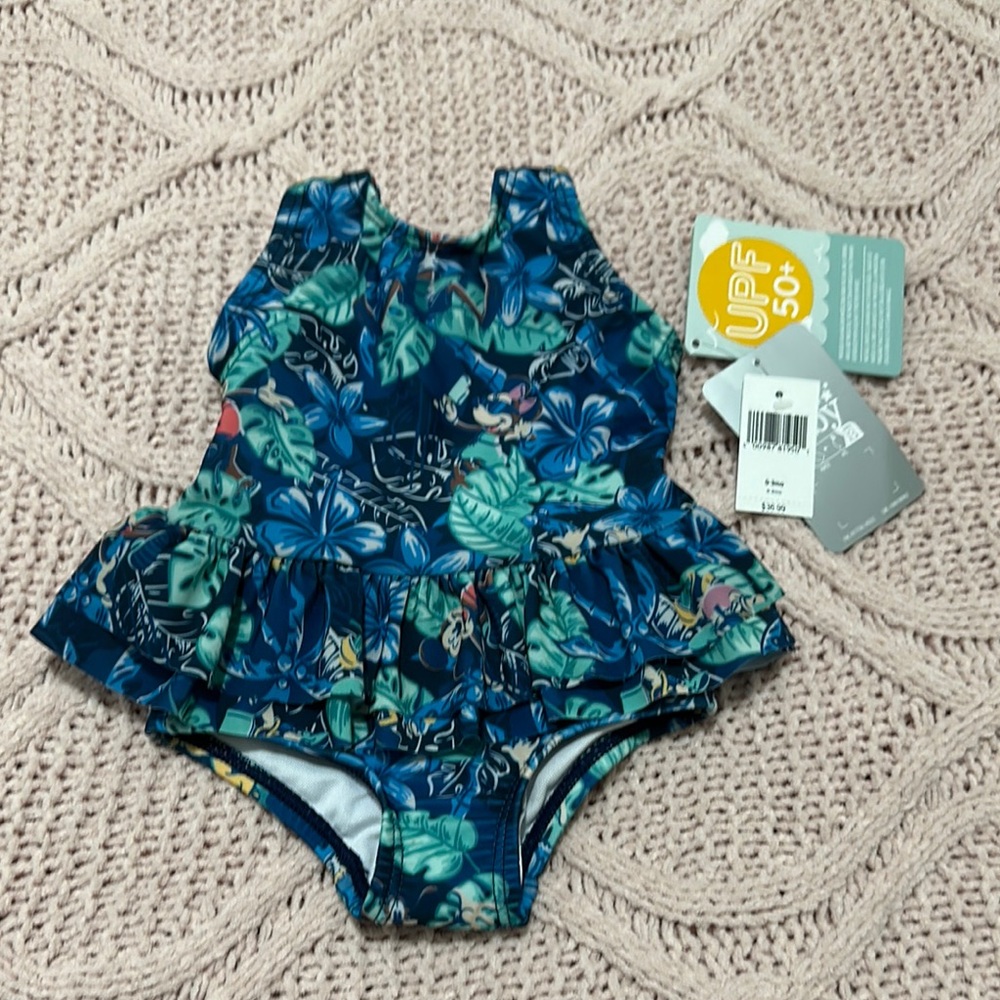 Floral Minnie, mouse adorable Blue Swim One Piece
I bought in the Disney park.